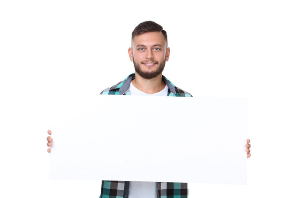 Young man holding blank board on white background - Фото, зображення
