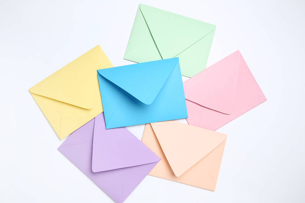 Colorful paper envelopes on white background - Foto, afbeelding