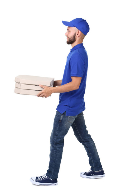 Delivery man with pizza in cardboard boxes isolated on white bac - Photo, image