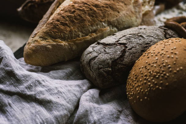 Many mixed breads and handmade bagels - Fotoğraf, Görsel