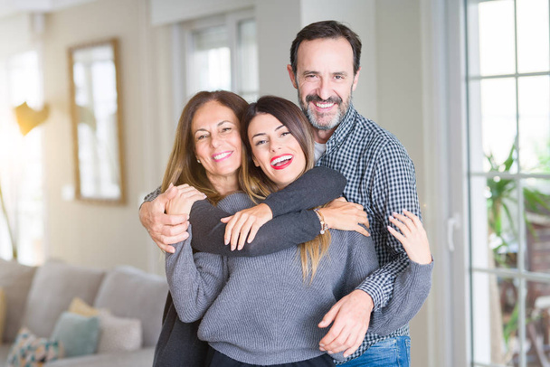 Beautiful family together. Mother, father and daughter smiling a - Photo, Image