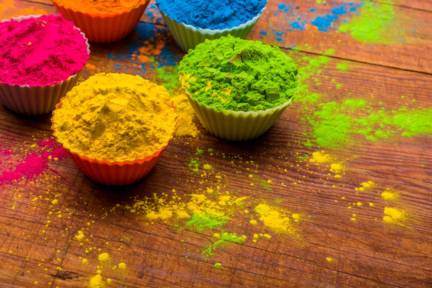 Holi color powder. Organic Gulal colours in bowl for Holi festival, Hindu tradition festive - Foto, Imagem