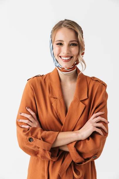Happy young blonde pretty woman wearing silk scarf posing isolated over white wall background. - Фото, зображення