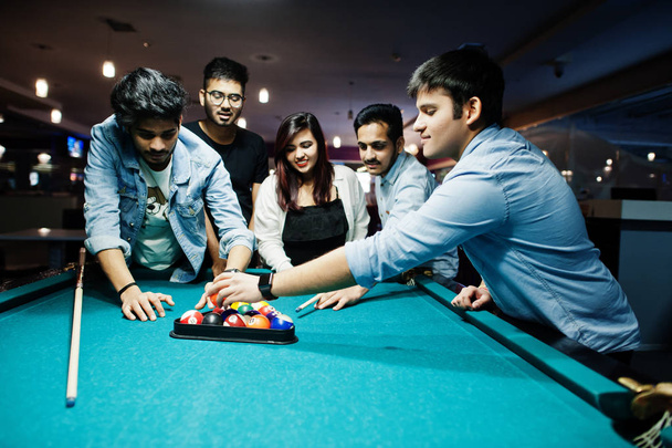 Group of stylish asian friends wear on jeans playing pool billia - Photo, Image