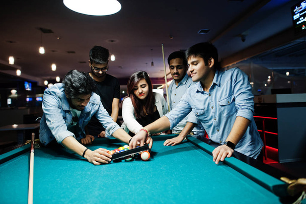 Group of stylish asian friends wear on jeans playing pool billia - Foto, Imagen