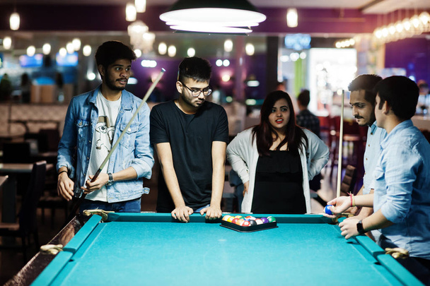 Group of stylish asian friends wear on jeans playing pool billia - Фото, зображення