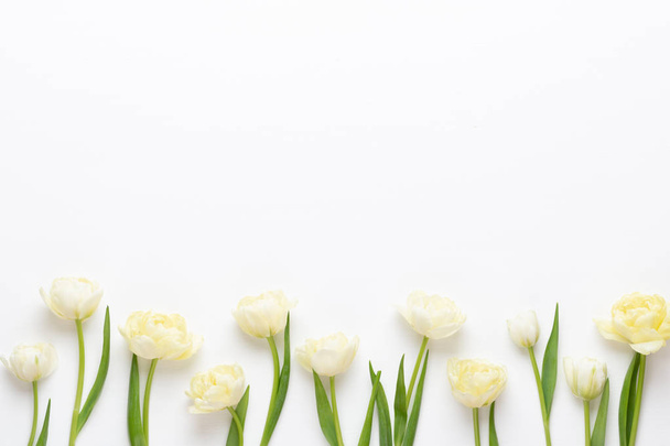 Spring flowers tulips on pastel colors background. Retro vintage - Photo, image