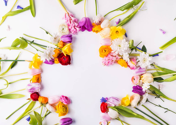 Flowers and cross Easter abstract concept on a white background. Copy space. - Foto, imagen