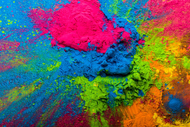 Abstract colorful Happy Holi background. Color vibrant powder on wood. Dust colored splash texture. Flat lay holi paint decoration - Valokuva, kuva