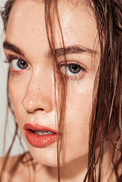 portrait of beautiful girl with coral lips and wet hair looking at camera - Valokuva, kuva