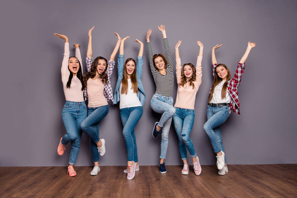 Full length body size photo beautiful yelling she her six ladies roommates hands arms raised up hanging out wearing casual jeans denim checkered striped clothes outfit isolated grey background - Photo, Image