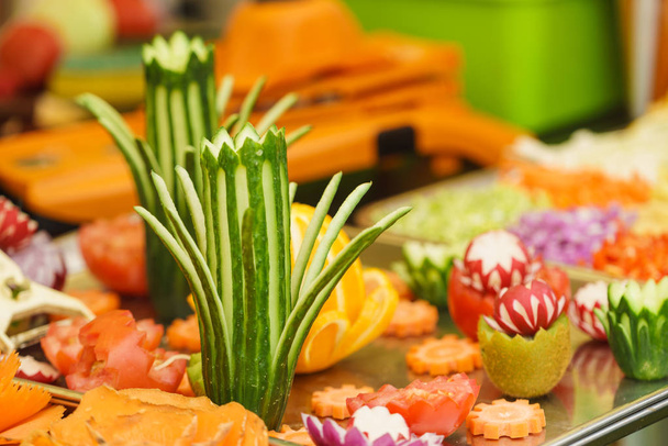 Decorative vegetables and fruits on plates - Foto, Bild