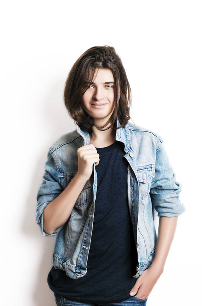Fashion portrait of a beautiful teenager wearing jeans jacket. - 写真・画像