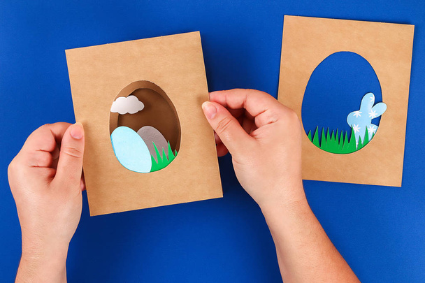 Diy Easter cards from paper. Volume greeting cards with a bunny, egg on blue background. 3d. - Fotoğraf, Görsel