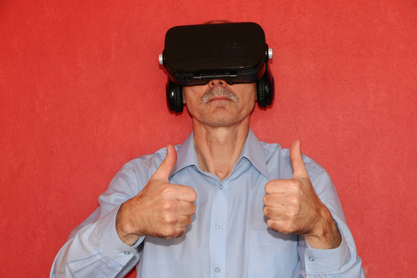 The man in a virtual reality glasses gesturing  - Photo, image