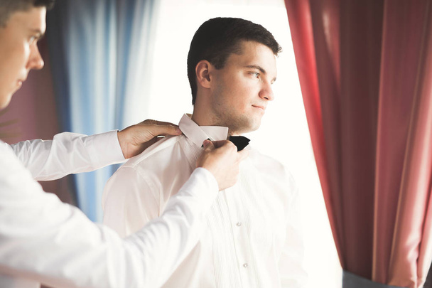 Beautiful man, groom posing and preparing for wedding - Фото, зображення
