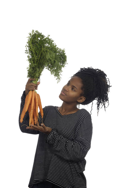 Adolescente jugando con una zanahoria
, - Foto, Imagen