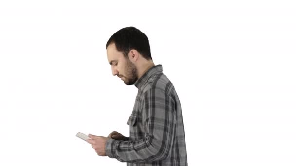 Tablet computer Side view of man using digital tablet on white background. - 映像、動画