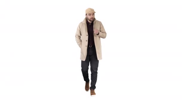 Talking young man in trench coat confidently talking to camera Just move forward on white background. - Footage, Video