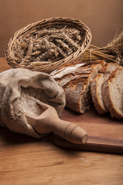 Baking theme table with bread - 写真・画像