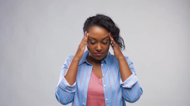 african american woman suffering from headache - Felvétel, videó