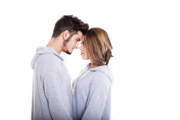 Couple standing face-to-face in white studio - Photo, Image