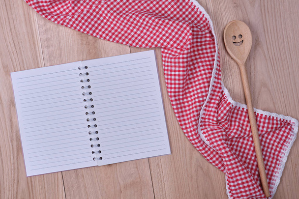 blank open notebook and wooden kitchen accessories - Photo, Image