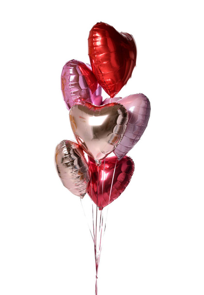 Bunch of metallic red pink heart balloons composition objects for birthday or valentines party isolated on a white  - 写真・画像