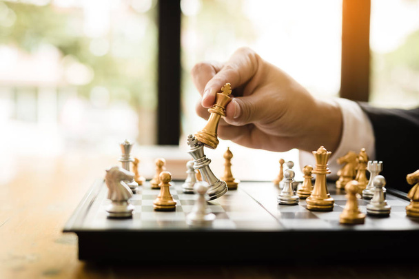 Businessman playing chess game beat opponent with strategy conce - Fotó, kép