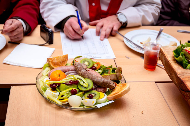Traditional sausages are arranged for review at food contest - Photo, Image