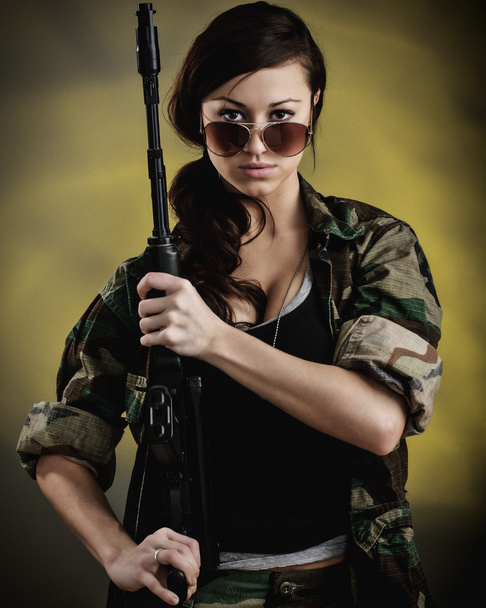Militarized Young Woman WIth Assault Rifle - Photo, image