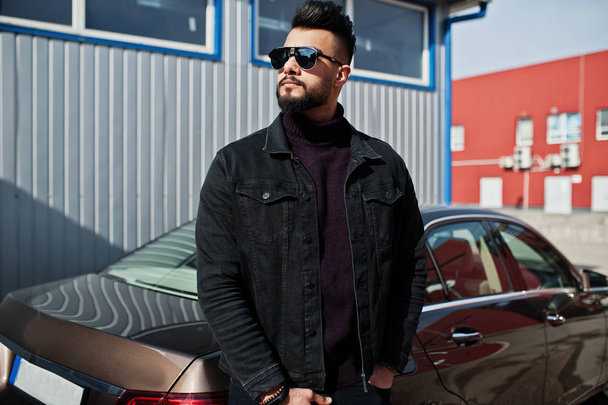Fashion Arab man wear on black jeans jacket and sunglasses posed - Foto, immagini