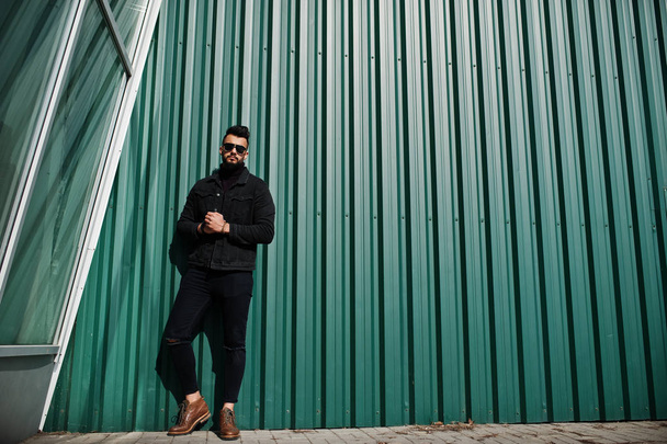 Fashion rich beard Arab man wear on black jeans jacket and sungl - Фото, изображение