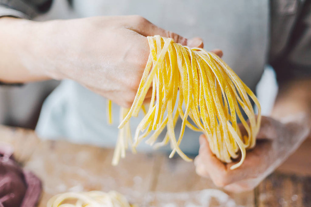 Chef making fresh italian pasta - Fotó, kép