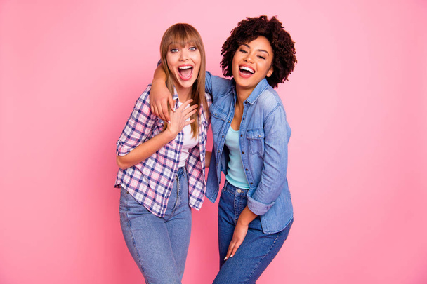 Close up photo two funky diversity she her ladies different race playful hear news unbelievable unexpected wondered wear casual jeans denim checkered shirt clothes outfit isolated pink background - Fotoğraf, Görsel