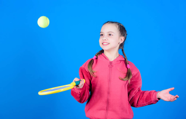Little girl. Fitness diet bring health and energy. sport school workout of teen girl. Sport game success. Tennis player with racket and ball. Childhood activity. Happy child play tennis. sport school - Fotografie, Obrázek