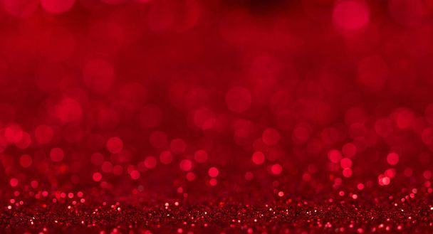 Bright beautiful sparkling red background with bokeh effect - Photo, Image