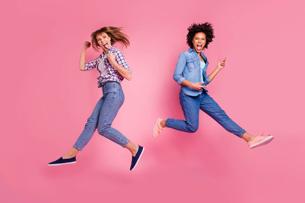 Full length body size view of two person nice crazy cool attractive charming cheerful funny funky playful girls having fun time weekend isolated over pink pastel background - Photo, Image