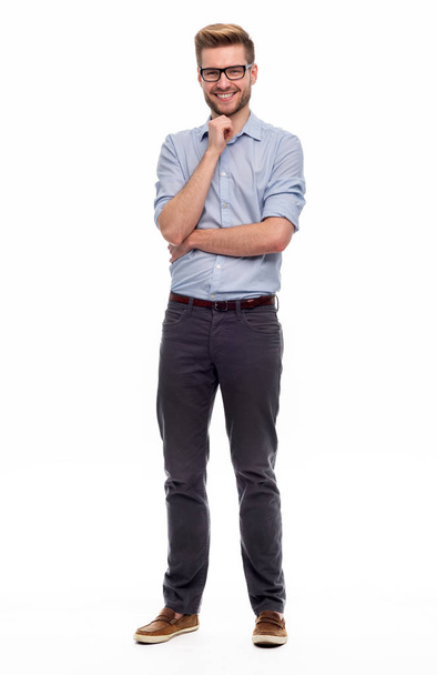 Full length portrait of young man standing on white background - Photo, Image