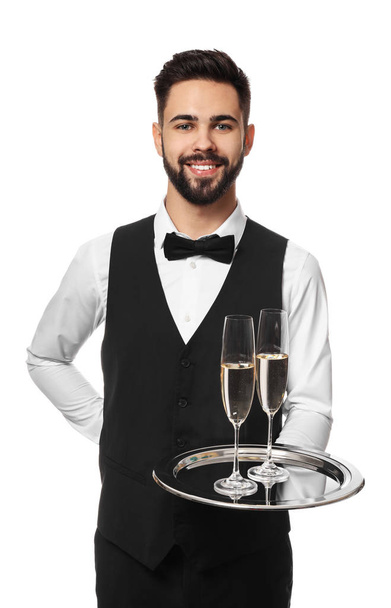 Handsome waiter with glasses of champagne on white background - Photo, Image