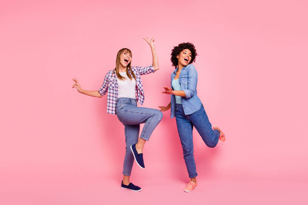 Full length body size view photo two funky diversity she her ladies dancing pop modern rhythms singer sing songs wear casual jeans denim checkered shirt clothes outfit isolated pink background - Photo, image