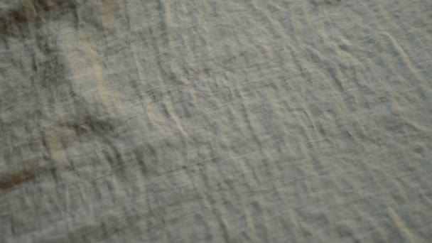 Background from bright satin fabric. close-up. pistachio fabric texture. - Felvétel, videó