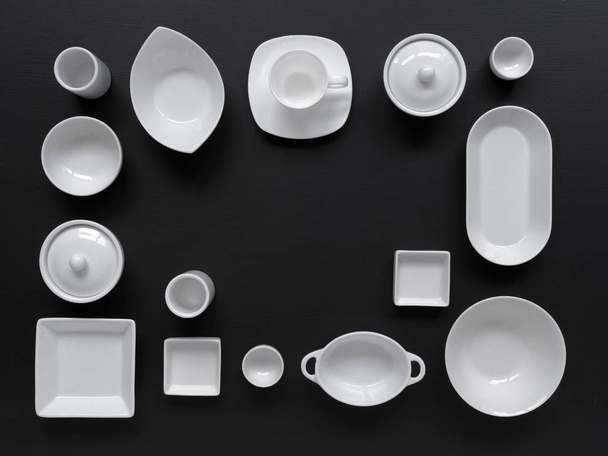 collection of white modern tableware on black background - Fotografie, Obrázek