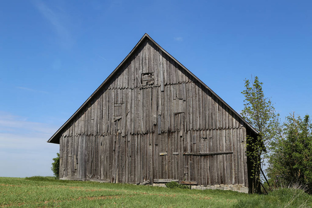 Old wooden shed in the middle of the field - Photo, Image