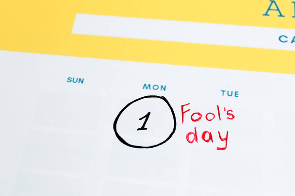 Calendar page of April with marked date of Fool's Day, closeup - Foto, Bild