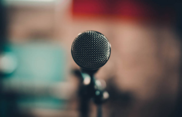 A close-up image of microphone on colored blurred background - Photo, Image