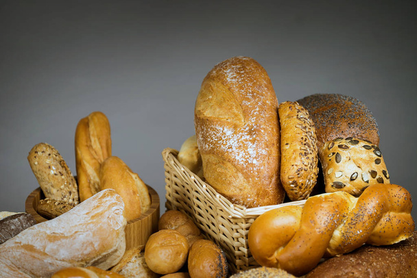 variety of delicious loaves of bread, food background - Photo, Image
