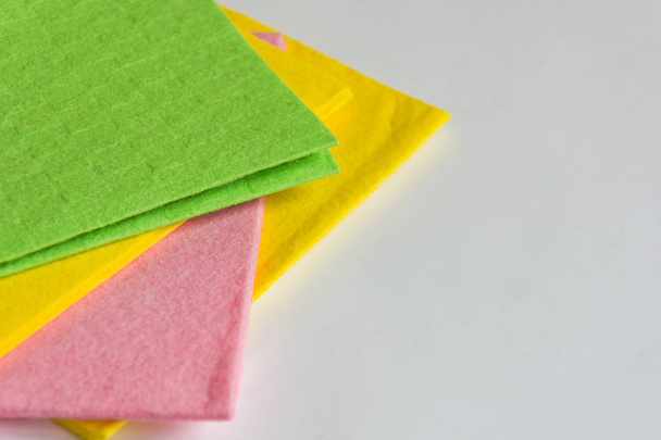 Colorful kitchen cleaning napkins on white background. - Zdjęcie, obraz