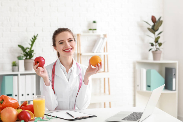 Portrait of female nutritionist in her office - Photo, Image