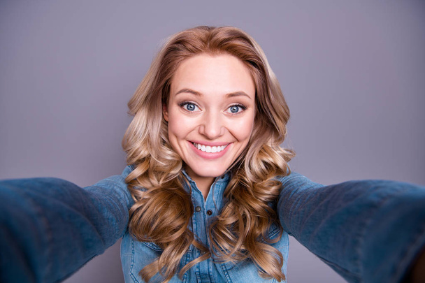 Self-portrait of her she nice cute fascinating lovely winsome charming attractive cheerful optimistic wavy-haired lady wearing blue shirt isolated over gray violet purple pastel background - Photo, Image